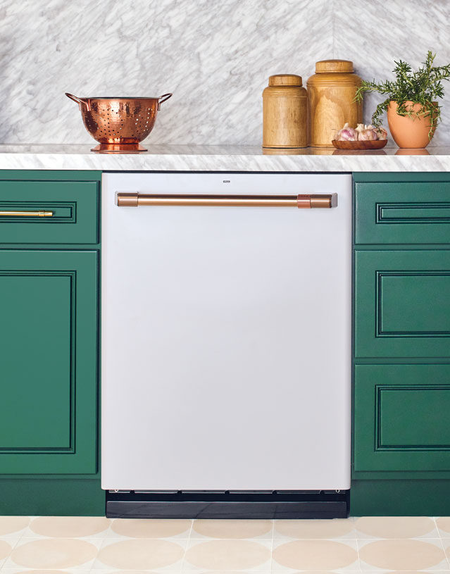 matte white dishwasher with green cabinets