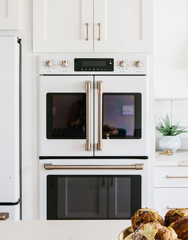 matte white french door double wall oven with white cabinets